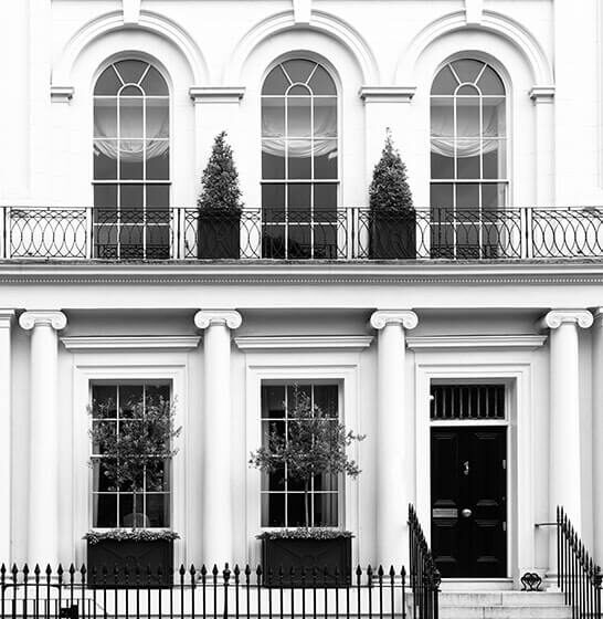 White facade of expensive apartment house in Kensington London