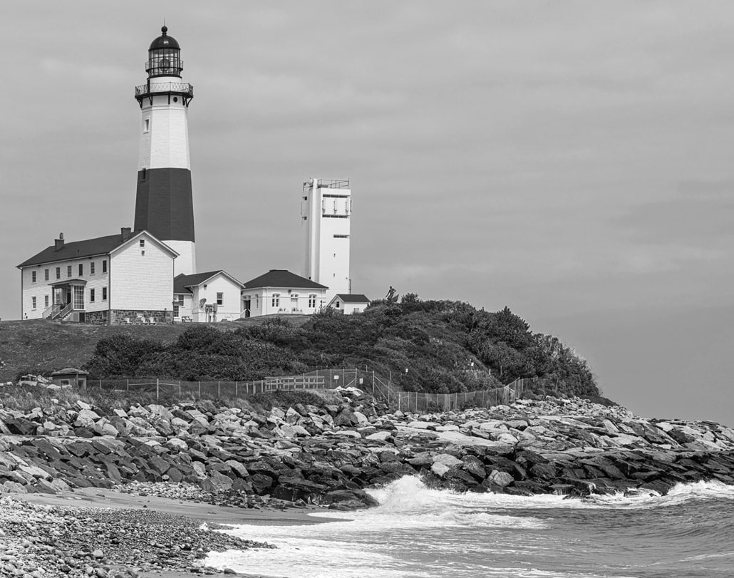 Montauk-Point-Lighthouse-viewed-from-the-rocky-shoreline
