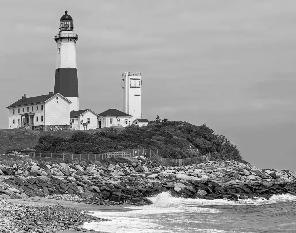 Montauk Point Lighthouse viewed from the rocky shoreline